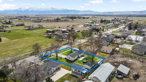 Birds eye view of property featuring a mountain view and a rural view