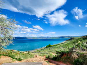 Property view of water with a mountain view