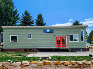 Rear view of property featuring a patio area