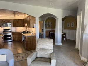 Kitchen (Left) Front Entry (Center) Formal Dining (Right)