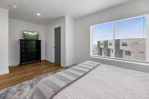 Bedroom with recessed lighting, baseboards, and wood finished floors