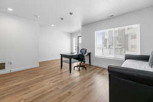 Office featuring visible vents, recessed lighting, light wood-type flooring, and baseboards