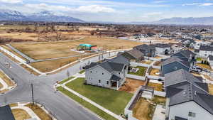 Birds eye view of property featuring a mountain view and a residential view