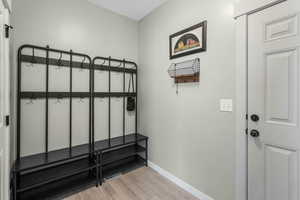 Interior space with baseboards and light wood-style floors