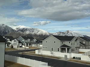 Property view of mountains with a residential view