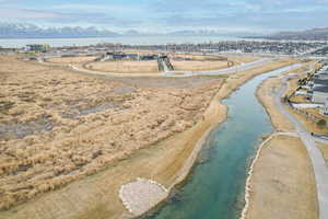 Drone / aerial view featuring a water view, walking trails