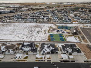 Snowy aerial view with a residential view