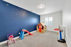 Game room with visible vents, baseboards, and carpet floors