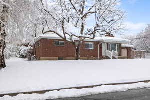 View of front of house featuring brick siding