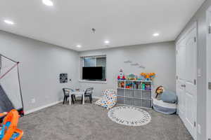 Playroom with carpet flooring, recessed lighting, and baseboards