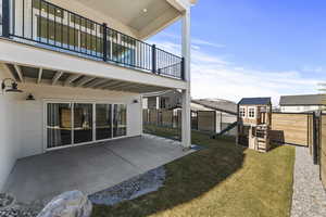 Exterior space featuring a balcony, and a fenced backyard