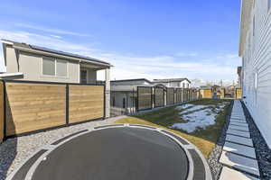 View of yard with a gate, a fenced backyard.