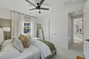 Bedroom featuring recessed lighting, light colored carpet, visible vents, and ceiling fan