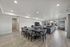 Lower Level Dining room with recessed lighting, light wood-style flooring.