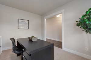 Office featuring baseboards and carpet floors
