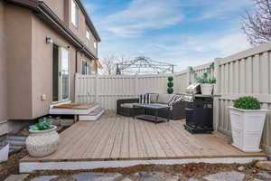 Deck with outdoor lounge area and fence