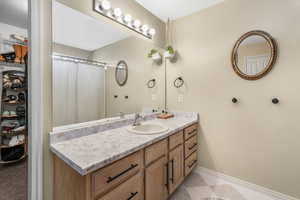 Bathroom with baseboards and vanity