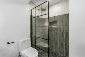 Bathroom with toilet and a walk in shower