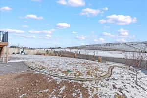 View of yard featuring a fenced backyard and a playground