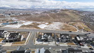 Birds eye view of property with a mountain view and a residential view