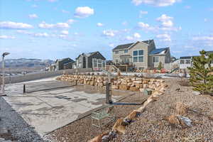 View of community featuring a residential view, a patio, and fence
