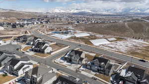 Birds eye view of property featuring a mountain view and a residential view