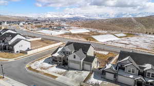 Drone / aerial view with a residential view and a mountain view
