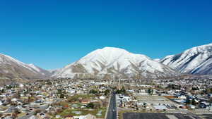 Property view of mountains with a residential view