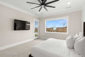 Carpeted bedroom featuring visible vents, crown molding, baseboards, recessed lighting, and access to outside