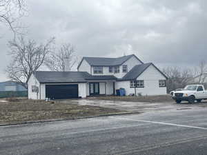 Traditional home featuring french doors and a garage