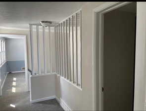 Corridor with visible vents and baseboards