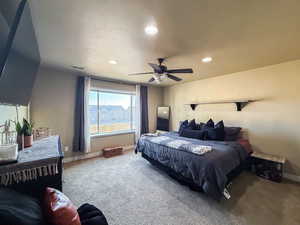 Carpeted bedroom featuring visible vents, recessed lighting, a ceiling fan, and baseboards