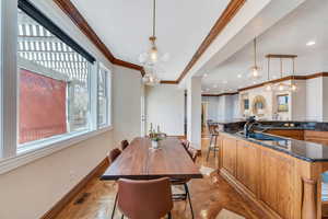 Dining space with recessed lighting, baseboards, visible vents, and ornamental molding