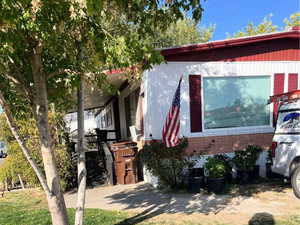 View of front of house with a front yard and brick siding