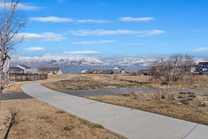 Exterior space featuring a residential view, a mountain view, and fence