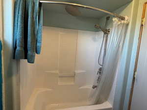Full bathroom with shower / tub combo