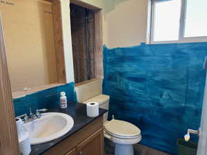 Bathroom with toilet and vanity