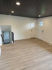 Interior space featuring light wood-style floors, baseboards, and recessed lighting