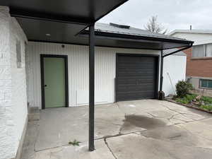 Garage featuring concrete driveway