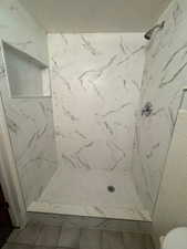 Full bath with a shower stall