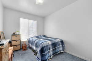 Carpeted bedroom with baseboards