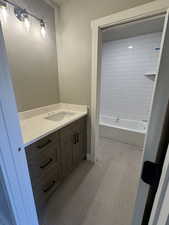 Bathroom featuring vanity and bathing tub / shower combination
