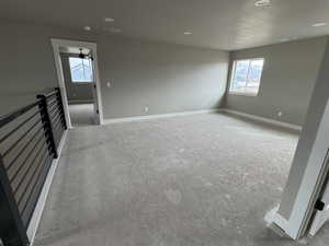 Empty room with visible vents, baseboards, and a textured ceiling