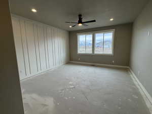 Spare room with recessed lighting, baseboards, and ceiling fan