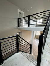 Stairs featuring baseboards and wood finished floors
