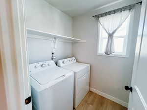 Laundry area with wood finished floors
