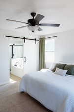Master Bedroom with barn door connecting to the Master Bathroom