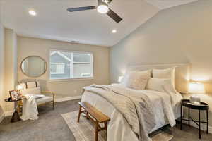 Carpeted bedroom with visible vents, baseboards, recessed lighting, ceiling fan, and vaulted ceiling