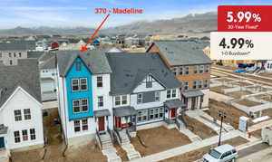 Aerial view of residential area with mountains