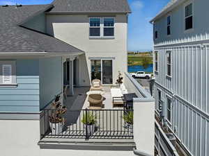 Exterior space with fence and a water view